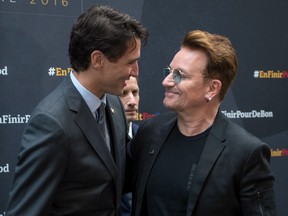 Prime Minister Justin Trudeau welcomes Bono at the Global Fund conference Saturday, September 17, 2016 in Montreal.