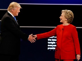 While Donald Trump had the advantage of his hand facing the audience, Hillary Clinton counteracted that by extending her arm fully, the pundits say.
