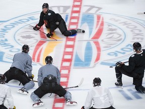 Aaron Ekblad (top) stretches with Team North America teammates at a Sept. 5 practice.