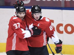 Team Canada's Sidney Crosby, right, celebrates his goal with teammate Patrice Bergeron during the first period of Canada's 4-1 win against Europe in World Cup of Hockey action in Toronto on Wednesday.