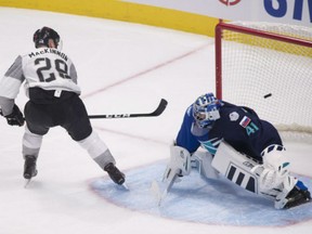 Team North America's Nathan MacKinnon scores on a penalty shot against Team Europe goaltender Jaroslav Halak during the third period of North America's 4-0 win on Thursday in Quebec City.