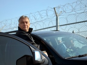 Hungary's Prime Minister Viktor Orban  tours the area where a fence was erected on the Bulgaria-Turkey border near the town of Lesovo, on September 14, 2016