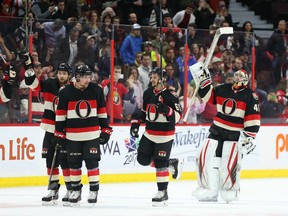 From left: Ottawa's Zack Smith, Cody Ceci, Erik Karlsson and Craig Anderson salute the fans after their final 2015-16 home game on April 7.