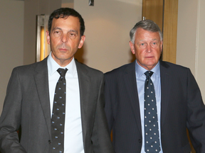 Justice Robin Camp, right, leaves a Canadian Judicial Council hearing with his lawyer Frank Addario.