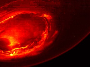 This Aug. 27, 2016 infrared image shows the southern aurora of Jupiter, captured by NASA's Juno spacecraft. The phenomenon can hardly be seen from Earth due to the position of the two planets. The image is a mosaic of three photographs made as the spacecraft was moving away from the gas giant.