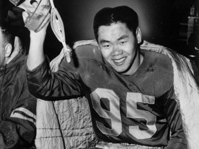 Norman Kwong sports Edmonton Eskimos equipment in an undated file photo.