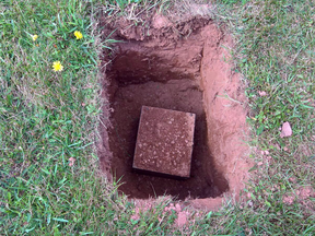 More than a century after 17-year-old Mary Tuplin, who's skull is contained in this box at her grave, was murdered in Margate, P.E.I., a ceremony has been held to reunite her head with her body.