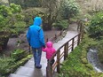 A Métis girl at the heart of a court fight between her foster parents and the B.C. government walks with her foster father in Butchart Gardens, near Victoria, B.C., in an image provided by her foster mother, in January 2016.