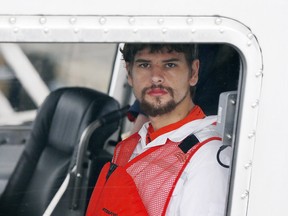 Nathan Carman arrives in a small boat at the US Coast Guard station in Boston, Tuesday, Sept. 27, 2016