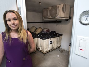 Melanie Sanche, head of sanitation for Montreal's public housing authority, stands at the threshold of a freezer room specially designed to kill the bedbugs on a resident's items, in Montreal on Monday, August 22, 2016.