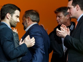 NDP Leader Thomas Mulcair, centre, leaves the stage following his concession speech, after the party voted for a leadership review during the 2016 NDP national convention in Edmonton on April 10.