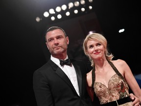 Schreiber and Watts posing on the red carpet before the premiere of the movie The Bleeder presented in competition at the 73rd Venice Film Festival at Venice Lido.
