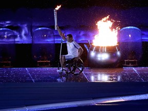 Paralympic swimming medalist Clodoaldo Silva lights the Paralympic flame during the opening ceremonies of the Rio Paralympics on Sept. 6.
