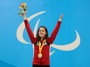 Canada's Aurelie Rivard celebrates winning gold in the women's 100m freestyle on Sept. 13.