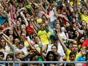 Paralympic spectators dance and cheer during women's sitting volleyball action in Rio on Sept. 10.
