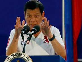Philippine President Rodrigo Duterte gestures while addressing Philippine Army Scout Rangers during his visit to their headquarters at Camp Tecson in San Miguel township, Bulacan province north of Manila, Philippines Thursday, Sept. 15, 2016.