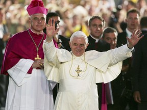 Pope Benedict XVI waves to the crowd before giving a talk at the University of Regensburg in Regensburg, Germany.