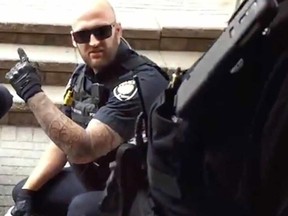 Youtube video screen grabs of one the officers accused of assault Abdirahman Abdi, who died in custody of Ottawa Police.