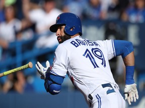 Jose Bautista runs after hitting a second-inning double against the Yankees on Sept. 24.