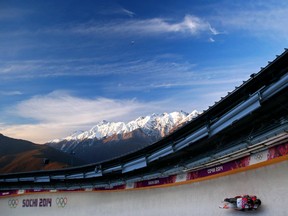 Canada's Tristan Walker and Justin Snith make a run during the Sochi 2014 men's luge doubles competition on Feb. 12, 2014.