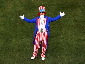A fan dressed as Uncle Sam poses during a Ryder Cup practice round on Sept. 28.