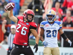Calgary's Rob Cote (left) spikes the ball after a two-point convert on Sept. 24.