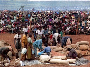 Some 90,000 Rwandan refugees wait to get food from the Red Cross 20 May in the Benako, Tanzania refugee camp.