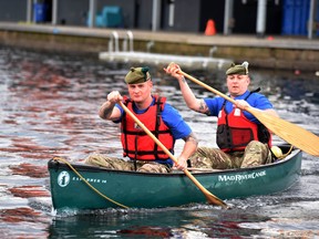 Pvt. Ryan O’Malley, foreground, and Color Sgt. Jim Gould of the Royal Regiment of Scotland paddle a canoe at in Glasgow, Scotland in July. Starting Aug. 30, 2016, they and 14 others are travelling from Montreal to New York City by canoe.