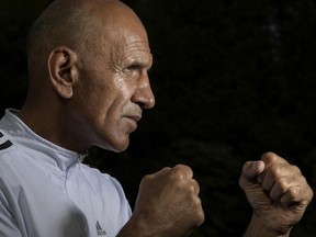 Mohammad Saber Sharif, the former coach of Afghanistan's women's boxing team, poses for a portrait at his new home in Leesburg, Va.