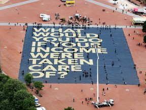 A huge poster reading, “What would you do if your income were taken care of?” is displayed in Geneva on May 14.
