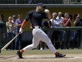 Tim Tebow went through drills at the University of Southern California's field last week in front of dozens of major league scouts and reporters.