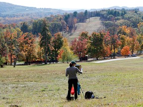 In this Oct. 17, 2014, file photo, artist Trish Wend, of New York, paints a scene of the Hudson Valley at Frederic Church's Olana State Historic Site in Hudson, N.Y.