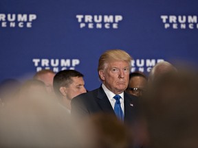 Donald Trump, 2022 Republican presidential nominee, listens to a speaker during a campaign event at the Trump International Hotel in Washington, D.C., U.S., on Friday, Sept. 16, 2016.