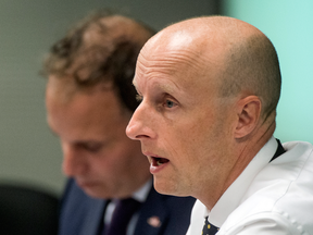 TTC CEO Andy Byford speaks at a TTC board meeting on Wednesday, with Chair Josh Colle in the background.