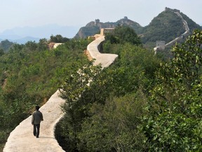 Chinese officials are being pilloried over the smoothing-over of a crumbling but much-loved 700-year-old section of the Great Wall of China in the name of restoration.