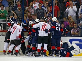 Canadian and U.S. players scrum during the third period of their exhibition game in Columbus on Sept. 9.