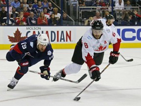 U.S. forward Brandon Dubinsky and Canada's Shea Weber battle for the puck during the first period of the U.S.'s 4-2 U.S. win in Columbus on Sept. 9.