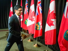 Ontario Attorney General Yasir Naqvi finishes addressing media at Queen's Park in Toronto, Ont. on Thursday September 8, 2016.