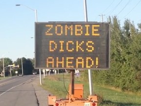 A hacked traffic sign on Hazeldean Road in Ottawa has a zombie warning for motorists.