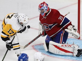 Canadiens goalie Al Montoya makes the save on a shot by the Pittsburgh Penguins' Brian Rust during third period NHL action in Montreal on Tuesday night.