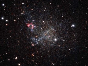 A handout image released by the European Southern Observatory on January 25, 2016 shows a small galaxy