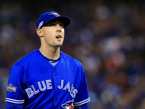 Toronto Blue Jays starter Aaron Sanchez walks off the field in the fourth inning against the Texas Rangers on Oct. 9.