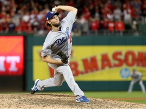Clayton Kershaw of the Los Angeles Dodgers works against the Washington Nationals in the ninth inning during Game 5 of the National League Division Series at Nationals Park on Thursday night.