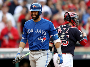 Jose Bautista grimaces after striking out to end the third inning of Game Two of the ALCS on Oct. 15.