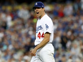 Dodgers starter Rich Hill of reacts while taking on the Chicago Cubs in Game 3 of the National League Championship Series at Dodger Stadium on Tuesday night in Los Angeles.