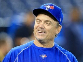 Toronto manager John Gibbons smiles during batting practice before Game Five of the ALCS on Oct. 19.