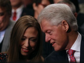 Former U.S. president Bill Clinton and his daughter Chelsea Clinton.