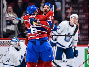 Canadiens defenceman Shea Weber (6) celebrates his third period goal with teammate Alexander Radulov during  NHL game against the Toronto Maple Leafs at the Bell Centre on Saturday.