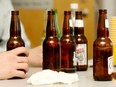 Empty beer bottles rest on a table as participants take part in a controlled level of impairment test at Algonquin College on Wednesday, January 16, 2008.