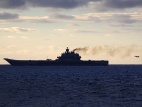 A plane coming in to land on the Russian aircraft carrier Admiral Kuznetsov south west of the city of Trondheim in international waters on its way to the mediterranean
